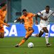 Jurrien Timber fights for the ball with USA's forward Haji Wright next to Netherlands' Virgil van Dijk.