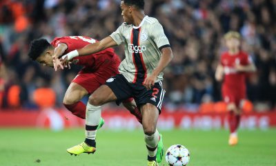 Ajax's Dutch defender Jurrien Timber fights for the ball with Liverpool's Colombian midfielder Luis Diaz. (Photo by LINDSEY PARNABY/AFP via Getty Images)