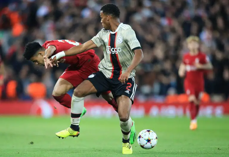 Ajax's Dutch defender Jurrien Timber fights for the ball with Liverpool's Colombian midfielder Luis Diaz. (Photo by LINDSEY PARNABY/AFP via Getty Images)