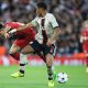 Ajax's Dutch defender Jurrien Timber fights for the ball with Liverpool's Colombian midfielder Luis Diaz. (Photo by LINDSEY PARNABY/AFP via Getty Images)
