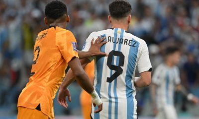 Argentina's Julian Alvarez is pushed by Netherlands' Jurrien Timber during a Qatar 2022 World Cup quarter-final football match.
