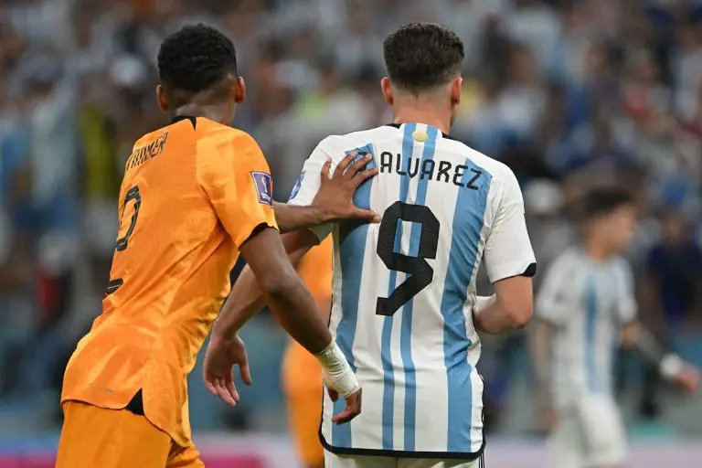 Argentina's Julian Alvarez is pushed by Netherlands' Jurrien Timber during a Qatar 2022 World Cup quarter-final football match.