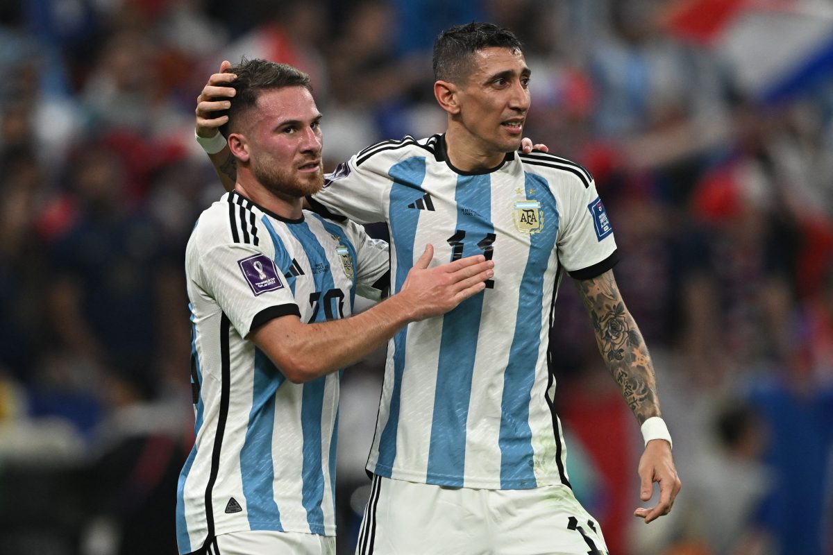 Angel Di Maria celebrates scoring his team's second goal with Alexis Mac Allister in the 2022 FIFA World Cup final between Argentina and France. 
