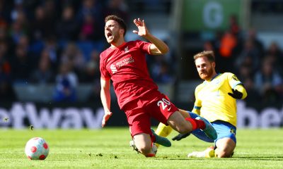 Diogo Jota of Liverpool is tackled by Alexis Mac Allister of Brighton.