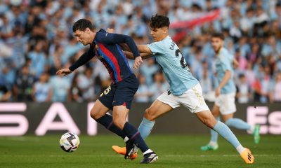 Andreas Christensen of FC Barcelona is challenged by Gabri Veiga of RC Celta.
