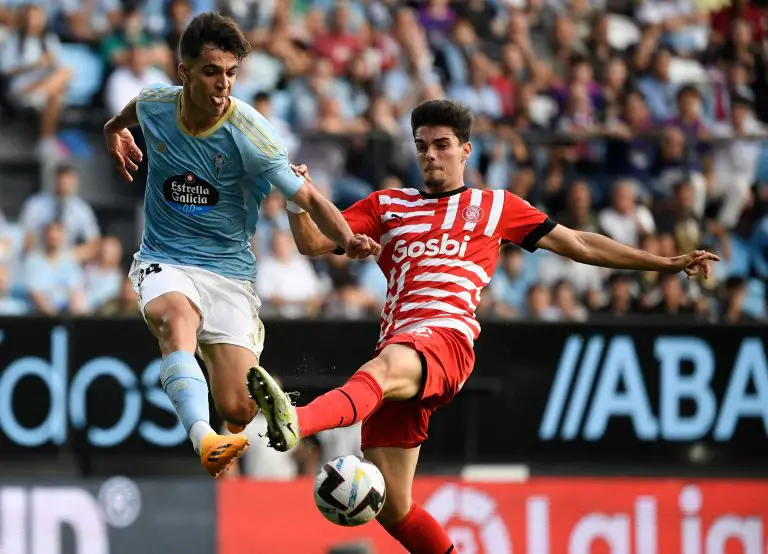 Celta Vigo's Spanish midfielder Gabriel Veiga fights for the ball with Girona's Spanish defender Miguel Gutierrez.