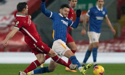 Liverpool's English midfielder James Milner vies with Brighton's Adam Lallana.