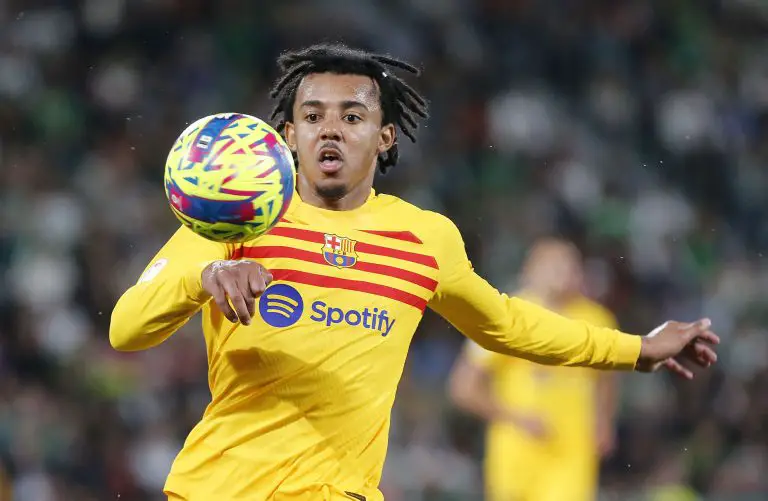 Barcelona's French defender Jules Kounde controls the ball.