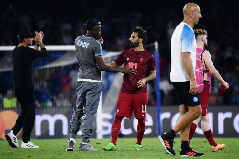 Liverpool's Egyptian forward Mohamed Salah (R) reacts with Napoli's Nigerian forward Victor Osimhen after Napoli won the UEFA Champions League Group A first leg football match between SSC Napoli and Liverpool FC at the Diego Armando Maradona Stadium in Naples on September 7, 2022. (Photo by Filippo MONTEFORTE / AFP) (Photo by FILIPPO MONTEFORTE/AFP via Getty Images)
