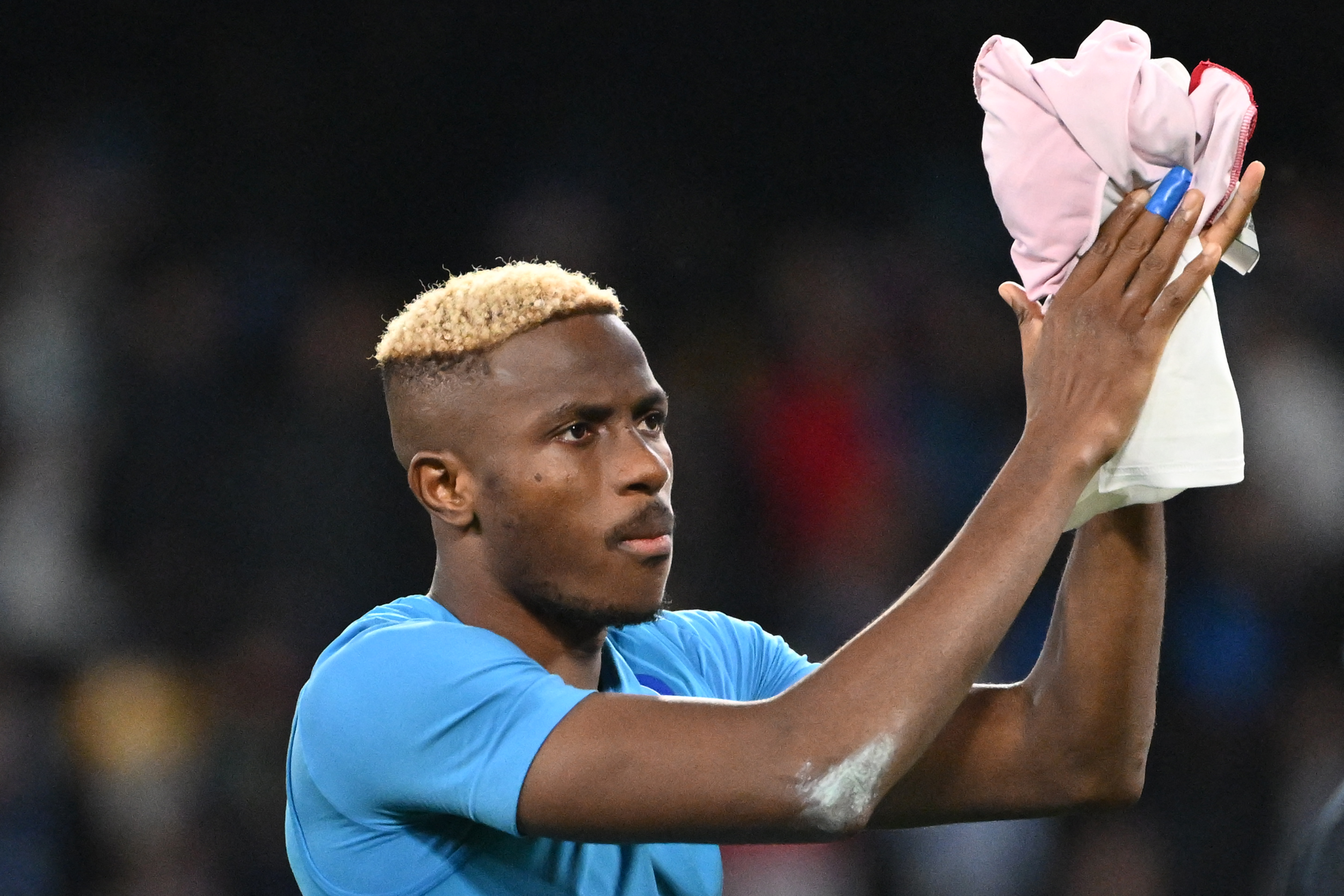 Napoli's Nigerian forward #09 Victor Osimhen celebrates after winning 2-0 the UEFA Champions League 1st round day 6 Group C football match Napoli vs Sporting Braga at the Diego Armando Maradona stadium in Naples on December 12, 2023. (Photo by Alberto PIZZOLI / AFP) (Photo by ALBERTO PIZZOLI/AFP via Getty Images)