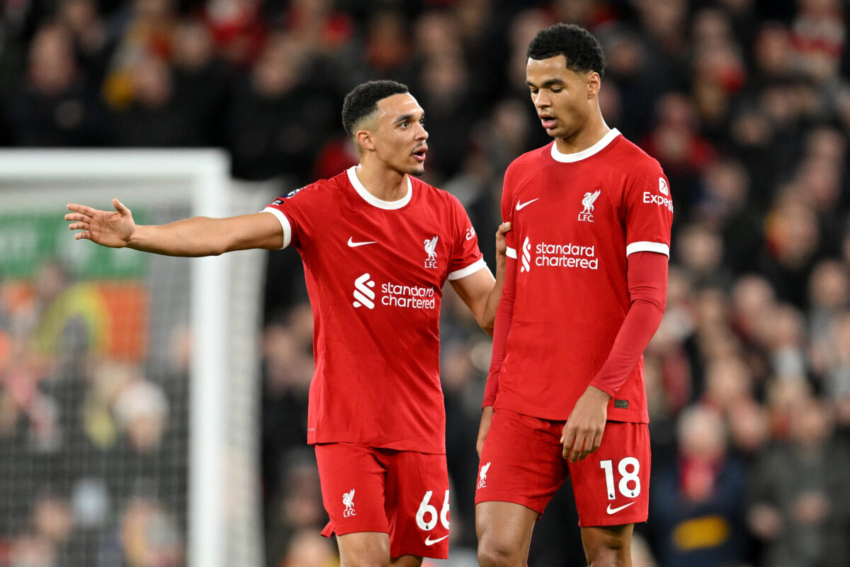 LIVERPOOL, ENGLAND - DECEMBER 23: Trent Alexander-Arnold of Liverpool speaks with teammate Cody Gakpo during the Premier League match between Liverpool FC and Arsenal FC at Anfield on December 23, 2023 in Liverpool, England. (Photo by Michael Regan/Getty Images)