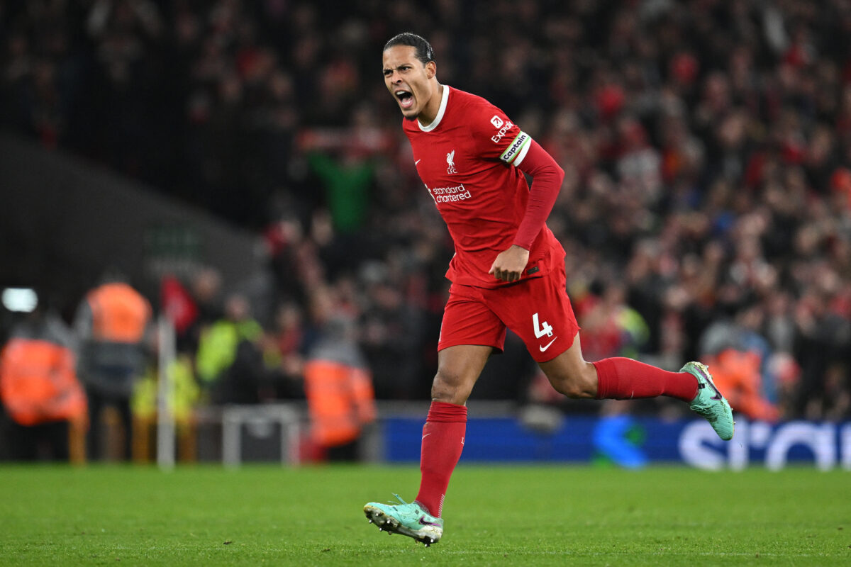 Liverpool's Dutch defender #04 Virgil van Dijk celebrates after scoring his team first goal during the English Premier League football match between Liverpool and Luton Town at Anfield in Liverpool, north west England on February 21, 2024. (Photo by Paul ELLIS / AFP) / RESTRICTED TO EDITORIAL USE. No use with unauthorized audio, video, data, fixture lists, club/league logos or 'live' services. Online in-match use limited to 120 images. An additional 40 images may be used in extra time. No video emulation. Social media in-match use limited to 120 images. An additional 40 images may be used in extra time. No use in betting publications, games or single club/league/player publications. /  (Photo by PAUL ELLIS/AFP via Getty Images)