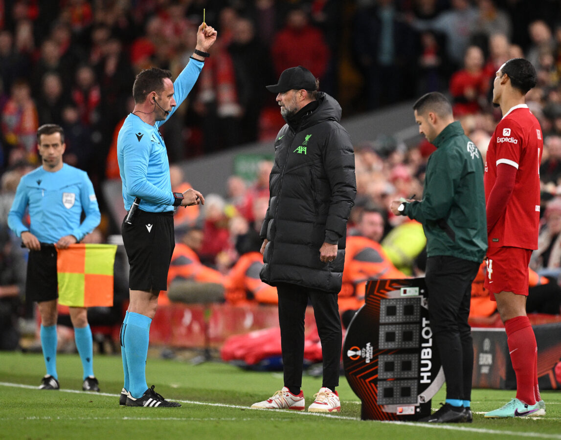 Referee Artur Manuel Ribeiro Soares Dias shows a yellow card to Liverpool's German manager Jurgen Klopp during the UEFA Europa League round of 16 second leg football match between Liverpool and AC Sparta Praha at Anfield in Liverpool, north west England on March 14, 2024. (Photo by Oli SCARFF / AFP) (Photo by OLI SCARFF/AFP via Getty Images)