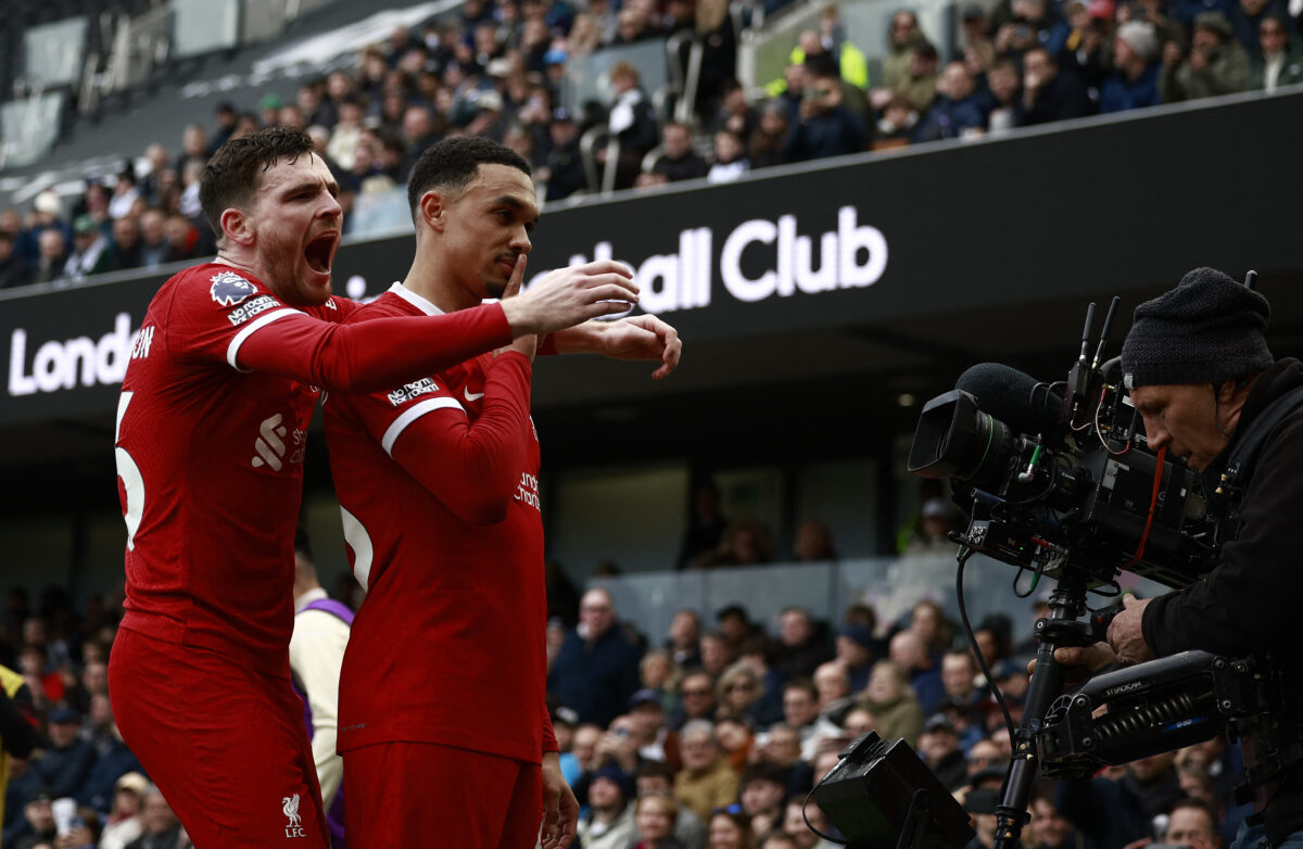 Liverpool's English defender #66 Trent Alexander-Arnold celebrates scoring the opening goal with Liverpool's Scottish defender #26 Andrew Robertson (L) during the English Premier League football match between Fulham and Liverpool at Craven Cottage in London on April 21, 2024. (Photo by BENJAMIN CREMEL / AFP) / RESTRICTED TO EDITORIAL USE. No use with unauthorized audio, video, data, fixture lists, club/league logos or 'live' services. Online in-match use limited to 120 images. An additional 40 images may be used in extra time. No video emulation. Social media in-match use limited to 120 images. An additional 40 images may be used in extra time. No use in betting publications, games or single club/league/player publications. /  (Photo by BENJAMIN CREMEL/AFP via Getty Images)