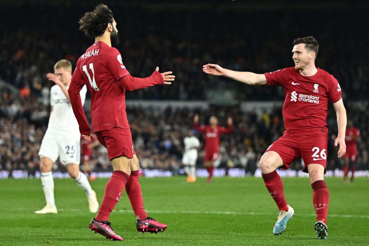 Liverpool's Egyptian striker Mohamed Salah (L) celebrates with Liverpool's Scottish defender Andrew Robertson (R) after scoring their second goal during the English Premier League football match between Leeds United and Liverpool at Elland Road in Leeds, northern England on April 17, 2023. (Photo by Oli SCARFF / AFP) / RESTRICTED TO EDITORIAL USE. No use with unauthorized audio, video, data, fixture lists, club/league logos or 'live' services. Online in-match use limited to 120 images. An additional 40 images may be used in extra time. No video emulation. Social media in-match use limited to 120 images. An additional 40 images may be used in extra time. No use in betting publications, games or single club/league/player publications. /  (Photo by OLI SCARFF/AFP via Getty Images)