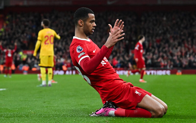 Liverpool's Dutch striker #18 Cody Gakpo celebrates after scoring his team third goal during the English Premier League football match between Liverpool and Sheffield United at Anfield in Liverpool, north west England on April 4, 2024. (Photo by Paul ELLIS / AFP) / RESTRICTED TO EDITORIAL USE. No use with unauthorized audio, video, data, fixture lists, club/league logos or 'live' services. Online in-match use limited to 120 images. An additional 40 images may be used in extra time. No video emulation. Social media in-match use limited to 120 images. An additional 40 images may be used in extra time. No use in betting publications, games or single club/league/player publications. / (Photo by PAUL ELLIS/AFP via Getty Images)