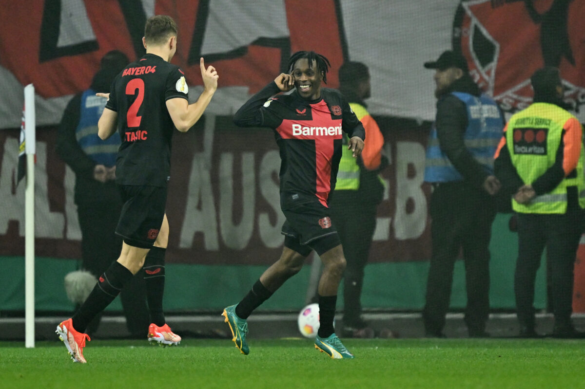 Bayer Leverkusen's Dutch defender #30 Jeremie Frimpong (R) celebrates scoring his team's first goal with team mate Bayer Leverkusen's Croatian defender #02 Josip Stanisic during the German Cup (DFB-Pokal) semi-final football match between Bayer 04 Leverkusen and Fortuna Duesseldorf in Leverkusen, western Germany on April 3, 2024. (Photo by INA FASSBENDER / AFP) / DFB REGULATIONS PROHIBIT ANY USE OF PHOTOGRAPHS AS IMAGE SEQUENCES AND QUASI-VIDEO. (Photo by INA FASSBENDER/AFP via Getty Images)