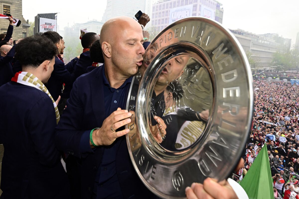 Feyenoord's Dutch head coach Arne Slot kisses the Champion's Plate on the balcony of the town hall during a ceremony to mark the club winning the Dutch 'Eredivisie' football league in Rotterdam on May 15, 2023. Feyenoord became national champions for the first time in six years. (Photo by Olaf Kraak / ANP / AFP) / Netherlands OUT (Photo by OLAF KRAAK/ANP/AFP via Getty Images)