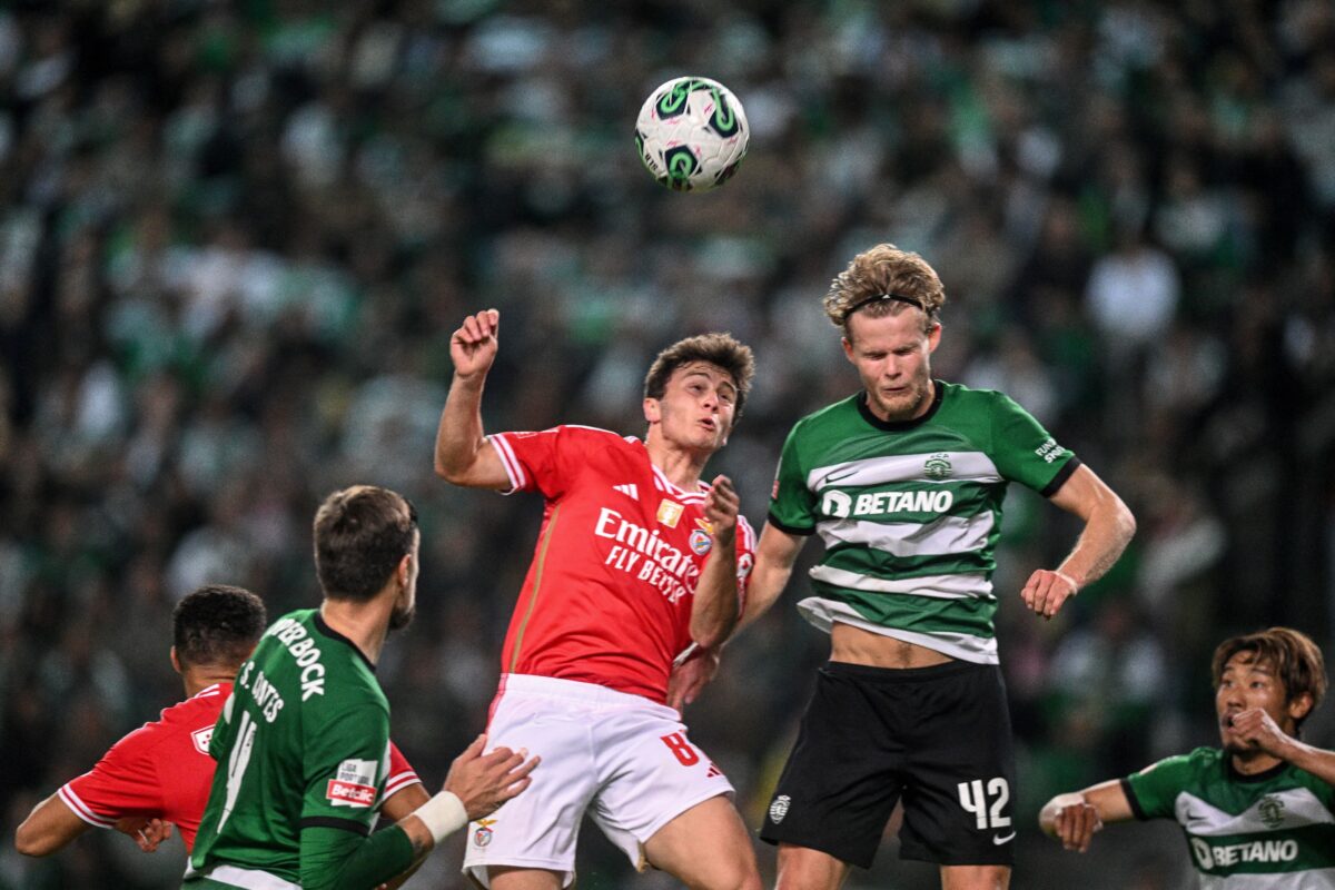 Sporting's Danish midfielder #42 Morten Hjulmand (R) heads the ball with Benfica's Portuguese midfilder #87 Joao Neves during the Portuguese League football match between Sporting CP and SL Benfica at the Jose Alvalade stadium in Lisbon on April 6, 2024. (Photo by PATRICIA DE MELO MOREIRA / AFP) (Photo by PATRICIA DE MELO MOREIRA/AFP via Getty Images)