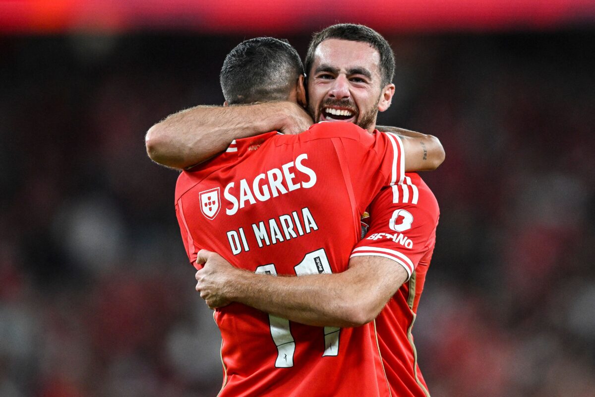 Benfica's Turkish midfielder #10 Orkun Kokcu celebrates with Benfica's Argentinian forward #11 Angel Di Maria after scoring a goalduring the Portuguese league football match between SL Benfica and Vitoria Guimaraes SC at the Luz stadium in Lisbon on September 2, 2023. (Photo by Patricia DE MELO MOREIRA / AFP) (Photo by PATRICIA DE MELO MOREIRA/AFP via Getty Images)