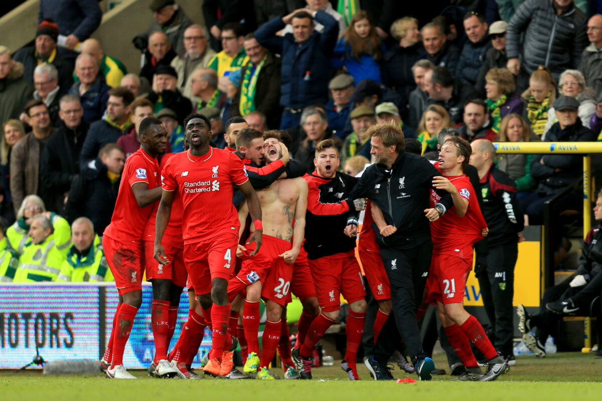 NORWICH, ENGLAND - JANUARY 23:  Adam Lallana (C) of Liverpool ceelbrates scoring his team's fifth goal with his team mates and manager Jurgen Klopp (2nd R) during the Barclays Premier League match between Norwich City and Liverpool at Carrow Road on January 23, 2016 in Norwich, England.  (Photo by Stephen Pond/Getty Images)