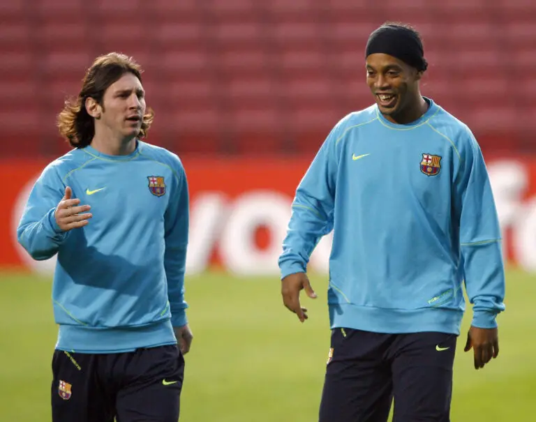 Barcelona's Brazilian midfielder Ronaldinho (R) and Argentinian Leo Messi (L) take part in a training session at the Camp Nou stadium in Barcelona, 06 November 2007 in Barcelona on the eve of their Champions League group E football match against Rangers FC. AFP PHOTO / LLUIS GENE (Photo credit should read LLUIS GENE/AFP via Getty Images)