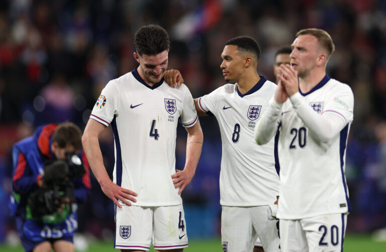 GELSENKIRCHEN, GERMANY - JUNE 16: Declan Rice of England speaks with teammate Trent Alexander-Arnold as players of England celebrate after the UEFA EURO 2024 group stage match between Serbia and England at Arena AufSchalke on June 16, 2024 in Gelsenkirchen, Germany. (Photo by Dean Mouhtaropoulos/Getty Images)