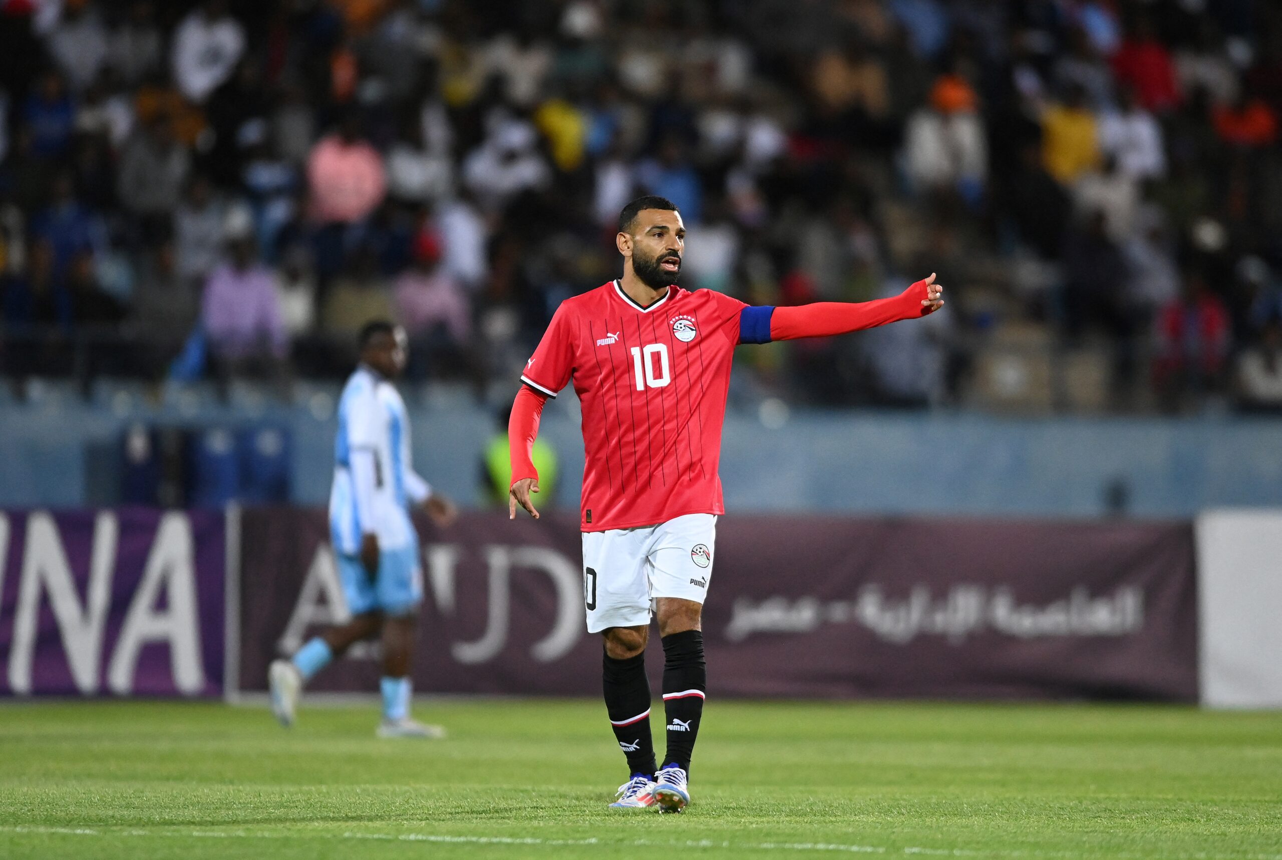 Salah leading his team to a huge win over Botswana in the CONCACAF. (Photo by Monirul Bhuiyan / AFP)