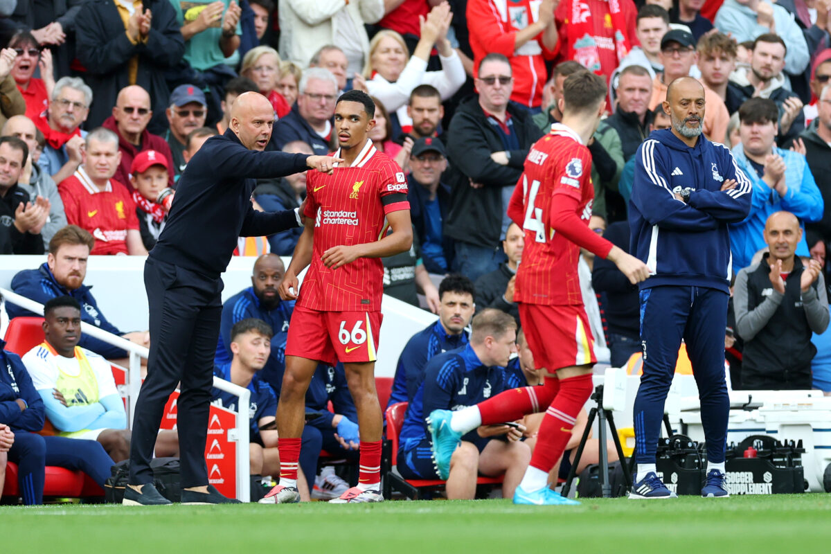 LIVERPOOL, ENGLAND - SEPTEMBER 14: Arne Slot, Manager of Liverpool, talks to Trent Alexander-Arnold of Liverpool during the Premier League match between Liverpool FC and Nottingham Forest FC at Anfield on September 14, 2024 in Liverpool, England. (Photo by Carl Recine/Getty Images)