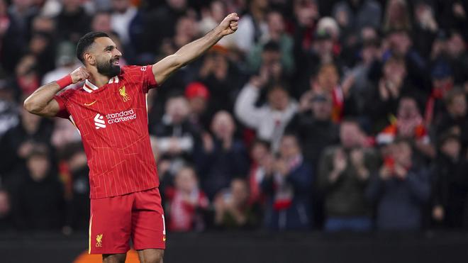 Liverpool’s Mohamed Salah celebrates scoring their side’s second goal during the Champions League opening phase match between Liverpool and Bologna at the Anfield stadium in Liverpool, England, Wednesday, Oct. 2, 2024. | Photo Credit: AP